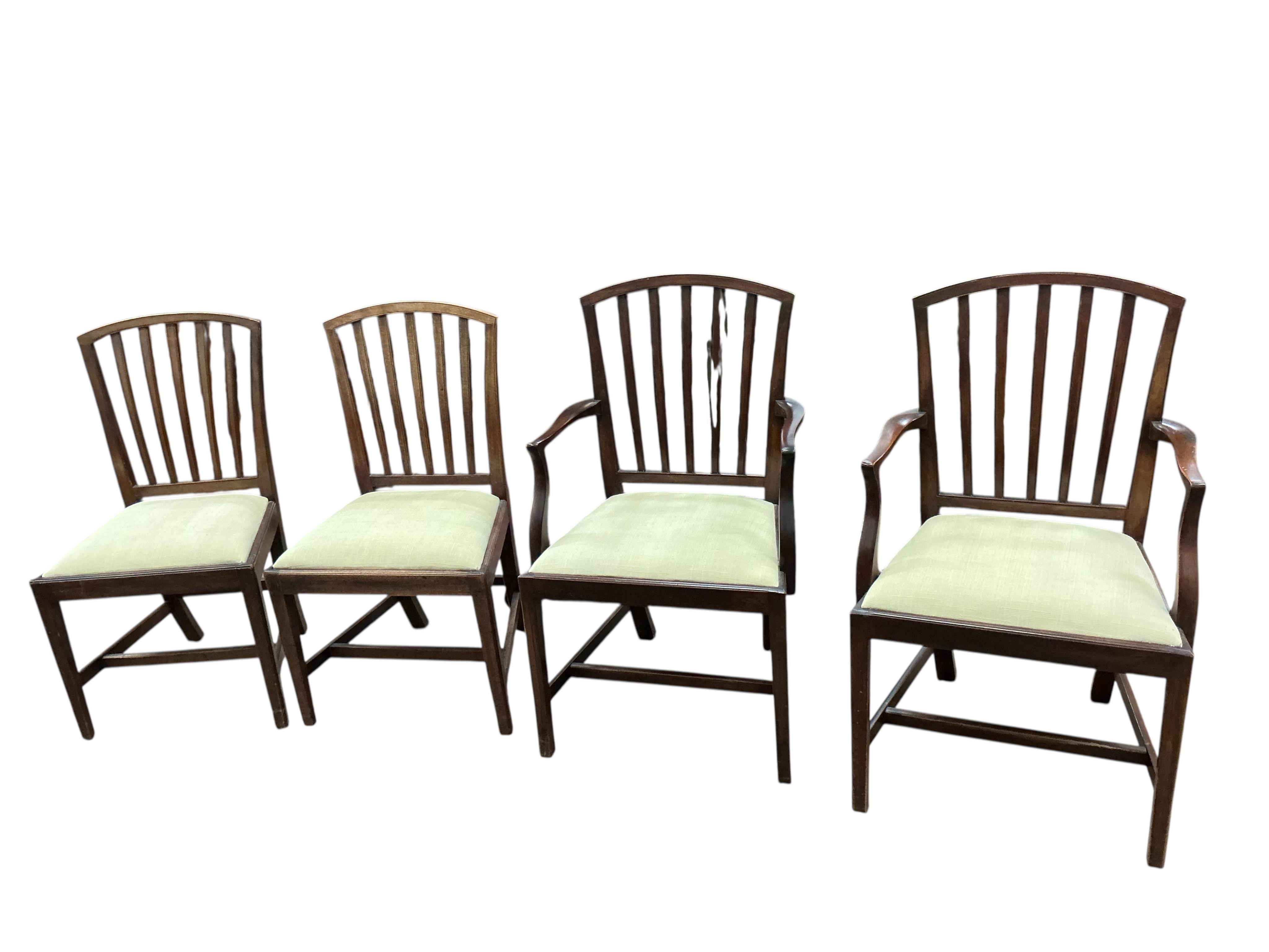 A set of six George III mahogany dining chairs with two matching later elbow chairs